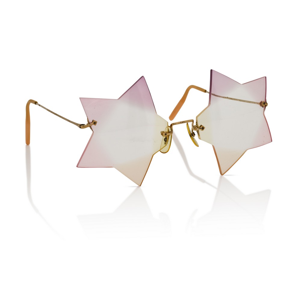 Occhiali rosa a forma di stella Freddie Mercury