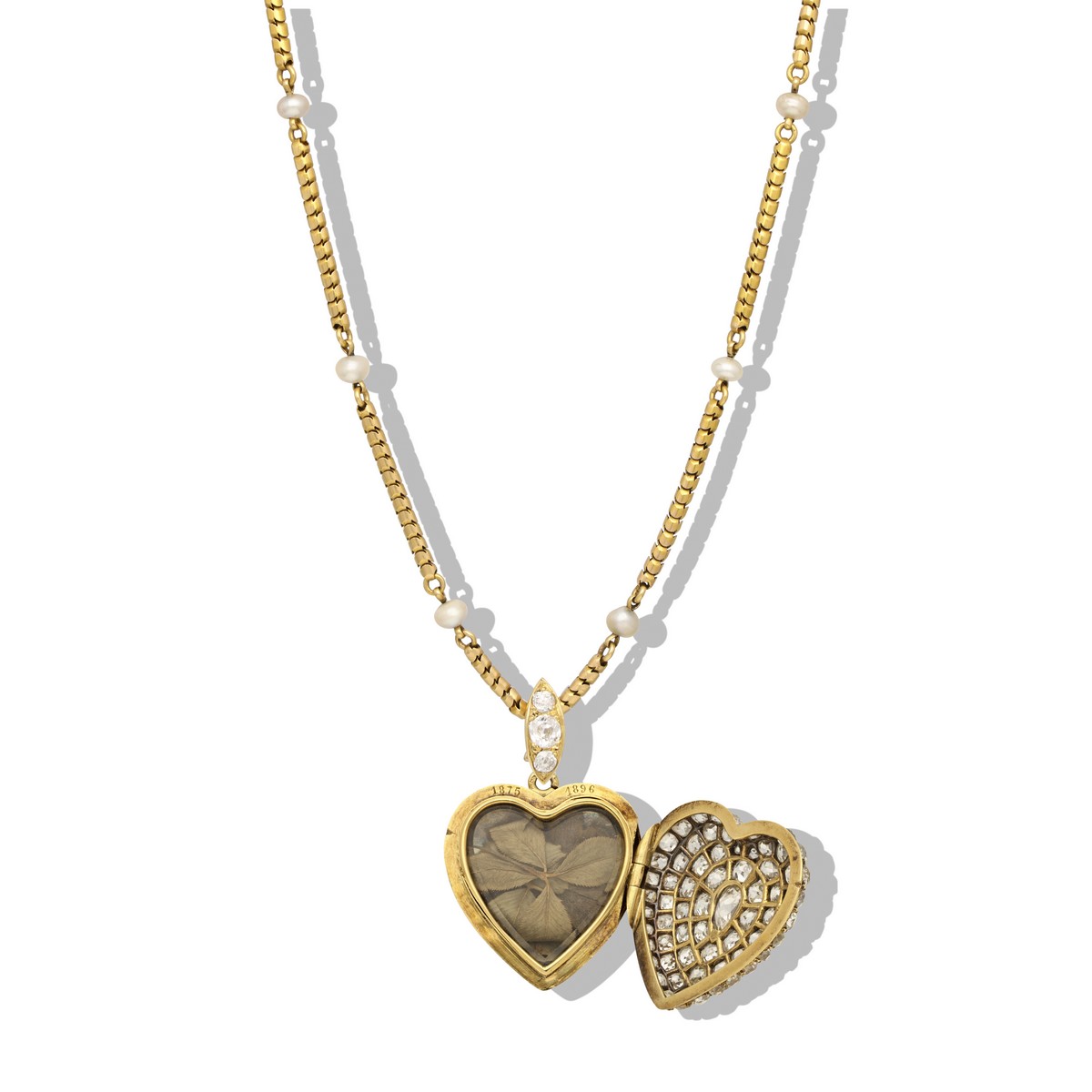 Collana di epoca vittoriana con ciondolo a cuore che ospita un raro quadrifoglio