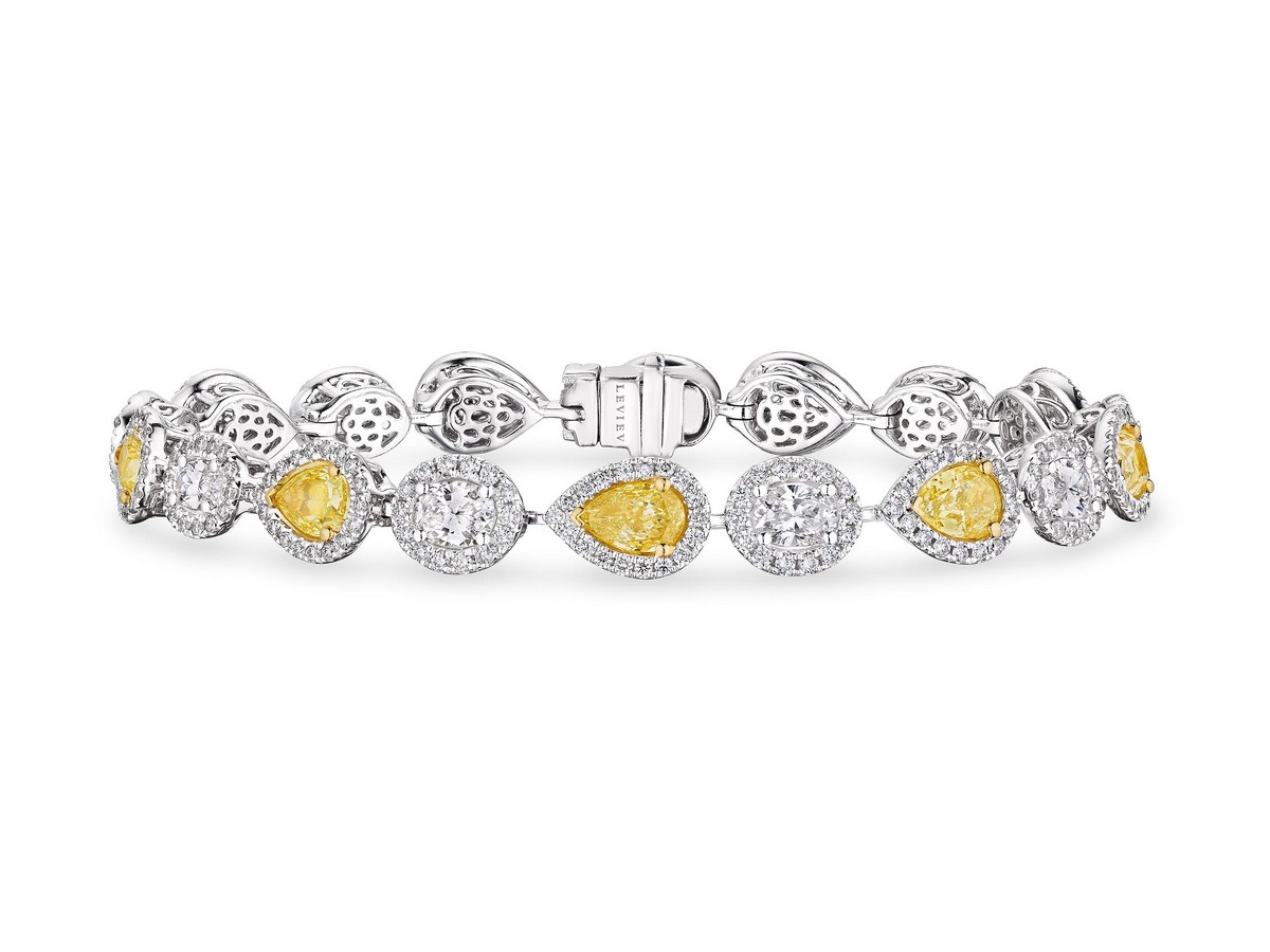 Bracciale in oro bianco e giallo 18kt, incastonato con diamanti fancy yellow taglio goccia e diamanti bianchi taglio rotondo